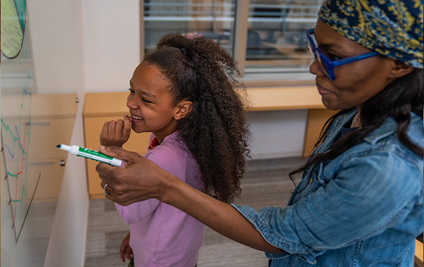 Girl Scout Volunteer with cookies