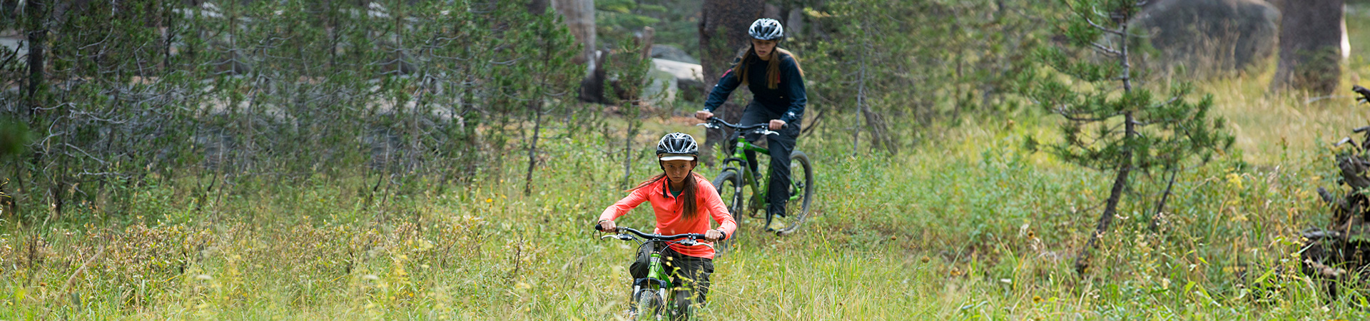  two girls mountain biking 