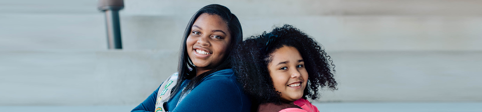  two girl scouts smiling 