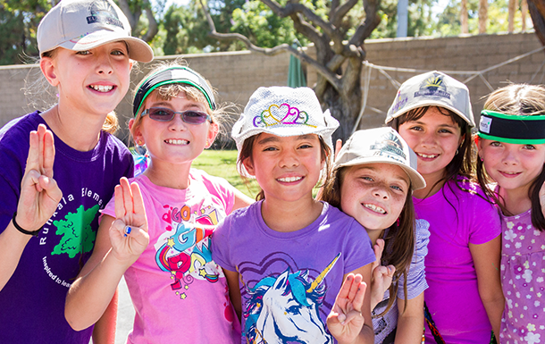 group of Girl Scouts outside smiling