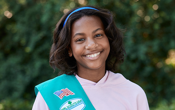 young girl scout smiling in uniform