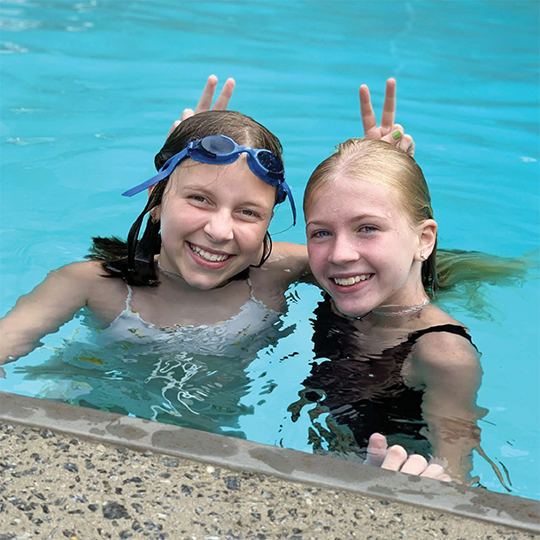 two girls in swimming pool