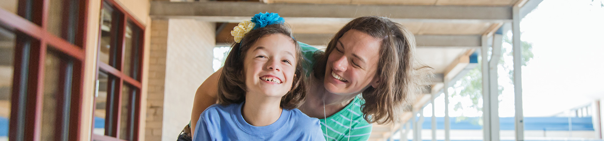  girl and adult smiling 